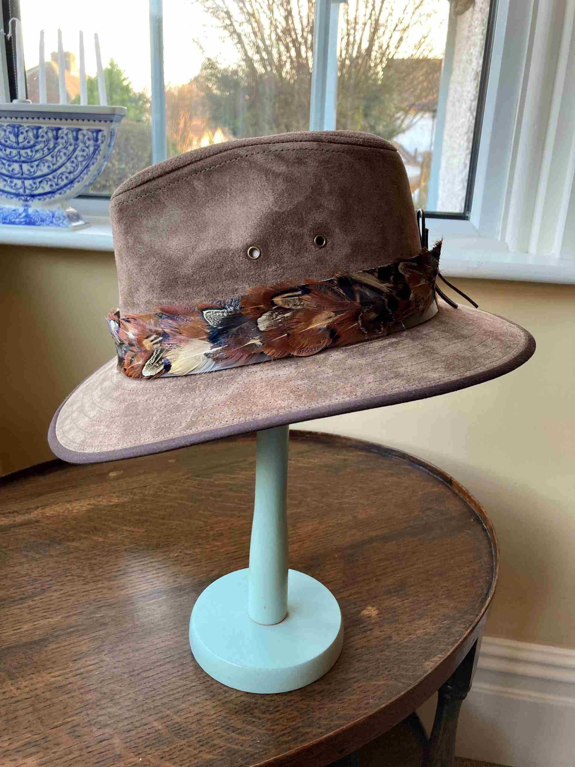 Leather hat showing mixed feather hat band